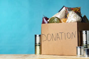 Wall Mural - Food donations on the table. Text Donation. Close up.