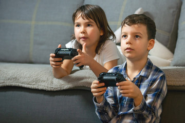 kids playing console games durring covid 19 outbreak