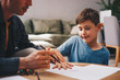 © Sanja - Cute boy and his father coloring pictures with crayons