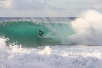 Wall Mural - man surfing in sea
