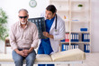 © Elnur - Old blind man visiting young male doctor