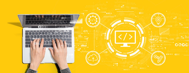 Wall Mural - web development concept with person using a laptop computer