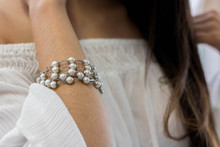 Midsection Of Woman Wearing Bracelet