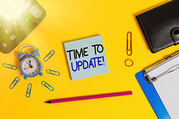 Wall Mural - Text sign showing Time To Update. Business photo text this is right moment to make something more modern new Alarm clipboard calculator wallet clip band pencil notepad color background