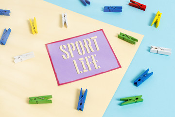 Handwriting text Sport Life. Conceptual photo Fond of sports or other outdoor activities Physically active Colored clothespin paper empty reminder yellow blue floor background office