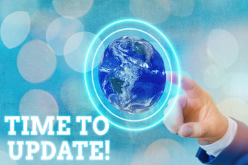 Wall Mural - Writing note showing Time To Update. Business concept for this is right moment to make something more modern new Elements of this image furnished by NASA
