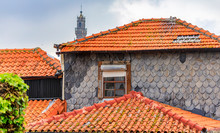 Shabby Facades And Terracotta Roofs Of Traditional Portuguese Houses In Disrepair, In Old Town Porto, Portugal