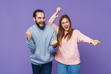 Sticker - Optimistic loving couple make winner gesture.