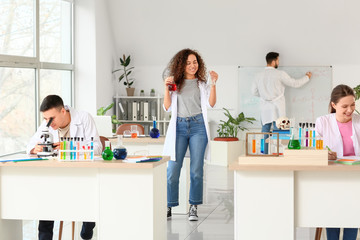 Poster - Young people at chemistry lesson in classroom