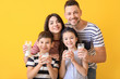 © Pixel-Shot - Family drinking milk on color background