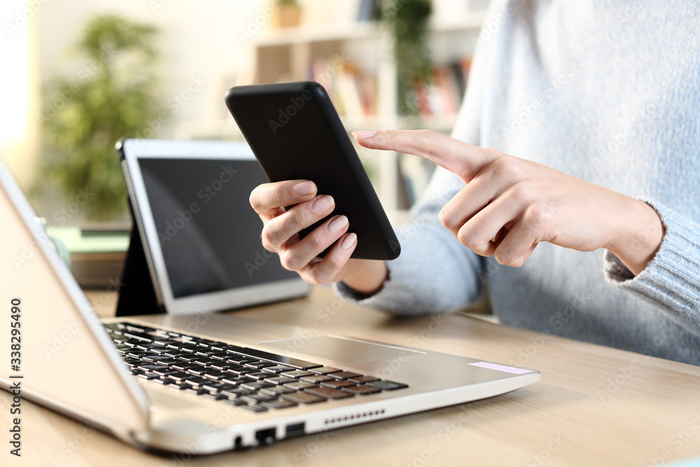 Someone Using Multiple Devices Girl hands using multiple devices on a desk Stock Photo | Adobe Stock