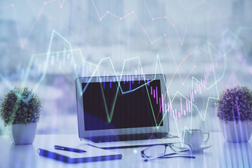 Forex graph hologram on table with computer background. Multi exposure. Concept of financial markets.