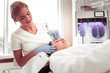 © zinkevych - Beauty expert doing facial treatment for her constant client