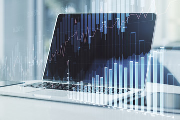 Double exposure of abstract creative financial chart on modern laptop background, research and strategy concept