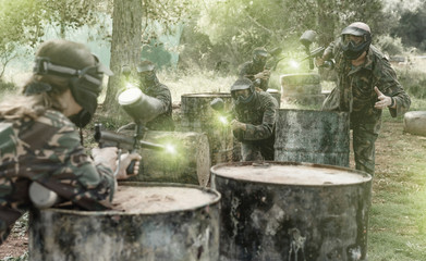 Wall Mural - Two opposing teams playing paintball against each other in battl