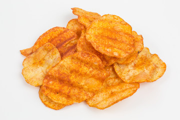 heap of potato crisps snack with paprika and sour cream flavor