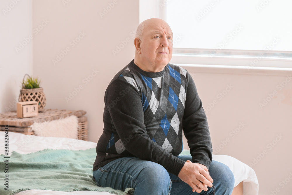 Elderly man suffering from mental disability at home