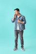 © Pixel-Shot - Coughing young man on color background