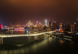 Fototapeta  - Aerial night view of Hong Ya Dong cave with Huanghuayuan and Qiansimen Bridge in Chongqing, southwest China