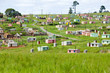 A village of brightly colored Mandela Houses in Zulu Village, Zululand, South Africa