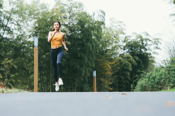 young asian beauty woman running outdoors