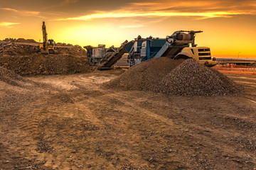 Wall Mural - Excavator collecting stone in an open-cast mine