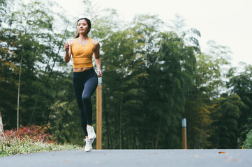 young asian beauty woman running outdoors