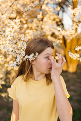 Preventive measures to protect against coronavirus. Young woman touches hands with eyes. Coronavirus epidemic. something caught my eye