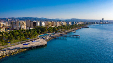 Canvas Print - Cyprus. Limassol. Wooden embankment. Panorama of the Cyprus coast. Resorts of the Mediterranean Sea. Summer vacation in Limassol. Embankment against the blue sky. Beaches of Cyprus. Island Cruises