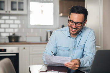 Young businessman holding a sketch in his hand.