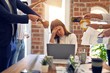 © Krakenimages.com - Group of business workers working together. Partners stressing one of them at the office