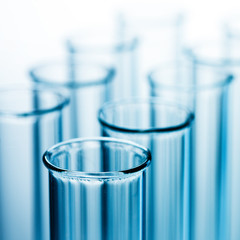 Wall Mural - different laboratory glassware with liquid and with reflection