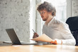 © master1305 - Typing text, analyzing, surfing. Caucasian young man in business attire working in office. Young businesswoman, manager doing tasks with smartphone, laptop, tablet has online conference, studying.