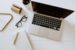 © Floral Deco - Home office desk workspace with laptop, notebook, glasses on white table. Flat lay, top view minimal women's, girl boss background.