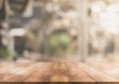 © DEEP PIXEL - 3D Rendering, Wooden top table with bokeh light effect and blur restaurant on background, blur background