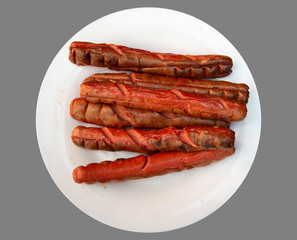 grilled beautiful delicious sausages on a white plate with no background for your design or menu