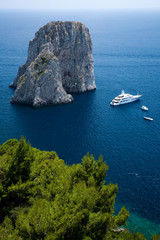 Wall Mural - Elevated view of blue waters of the City of Capri, an Italian island off the Sorrentine Peninsula on the south side of Gulf of Naples, in the region of Campania, Province of Naples, Italy, Europe