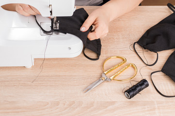 sewing masks at home to protect against viruses.