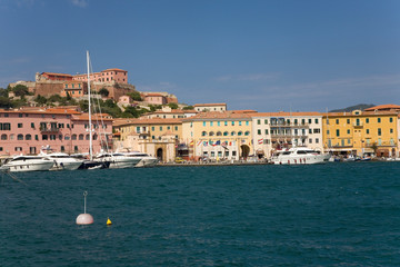 Wall Mural - Colorful buildings and harbor of Portoferraio, Province of Livorno, on the island of Elba in the Tuscan Archipelago of Italy, Europe, where Napoleon Bonaparte was exiled in 1814