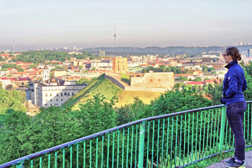 Sticker - Girl viewing the Gediminas Tower and Lower Castle of Vilnius