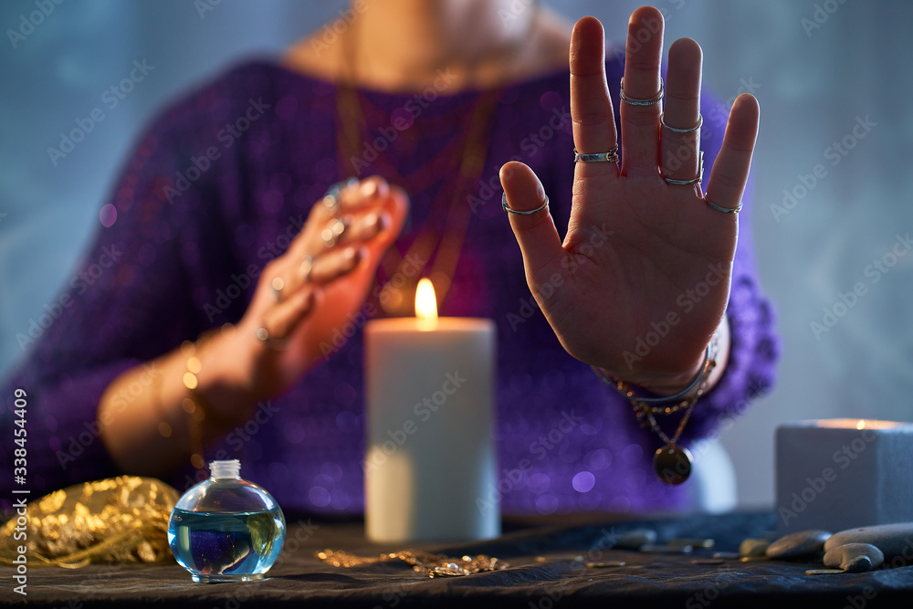 Fortune teller woman using burning candle flame for spell, witchcraft, divination and fortune telling. Spiritual esoteric occult magic ritual illustration - obrazy, fototapety, plakaty 