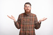 © Vulp - I dont know what to do, photo of frustrated bearded man standing over white background and gesturing