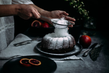 cake with red orange on a dark background