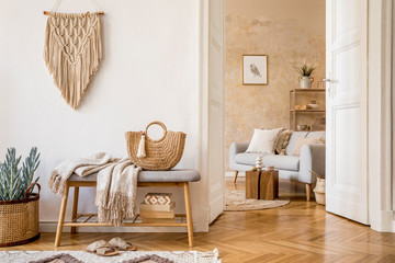 Wall Mural - scandinavian interior of open space with wooden bench, grey sofa, pillows, palid, picture frame, mac