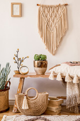 Wall Mural - stylish composition of living room interior with mock up frame, wooden bench, pillow, plaid, woman b