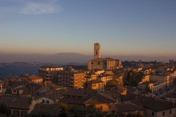 Perugia cityscape from the top at sunset, with San Domenico church in the background