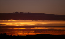 Wind Turbines On A Background Of Orange Sunset Sky