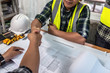 © KL 1981 - Engineer designer and Architect people shaking hands in the office for building agreement of partners in meeting. Handshake of civil engineer business concept.