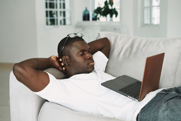 Poster - A man of African appearance laptop rest