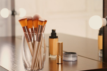 Canvas Print - Decorative cosmetics and tools on dressing table in makeup room, close up